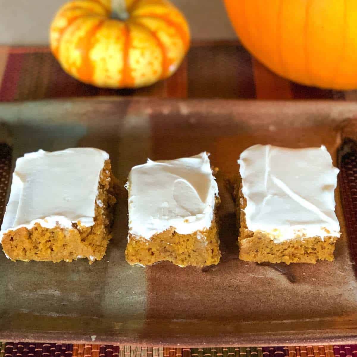 A row of pumpkin bars on a plate
