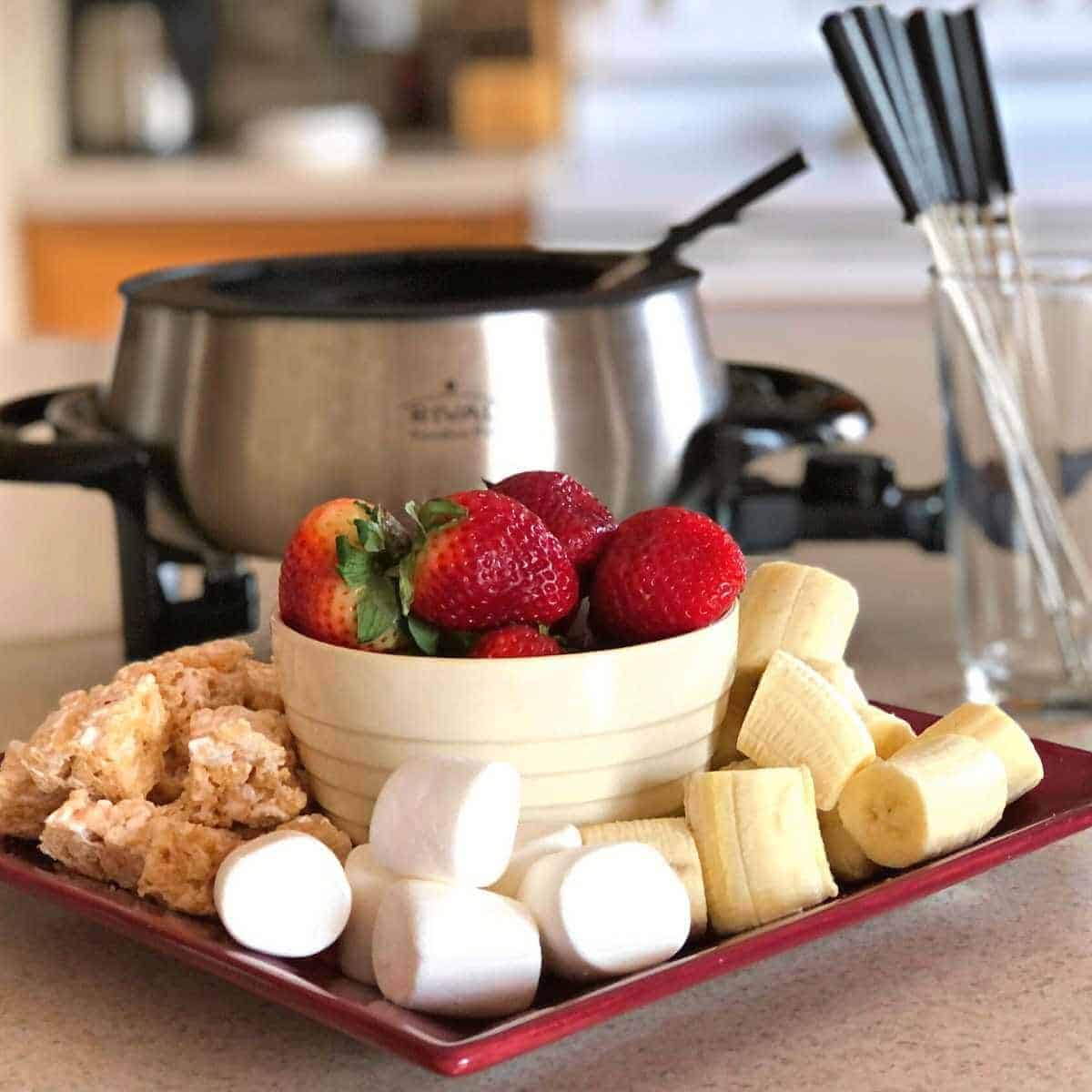 A variety of foods to dip in dairy-free chocolate fondue