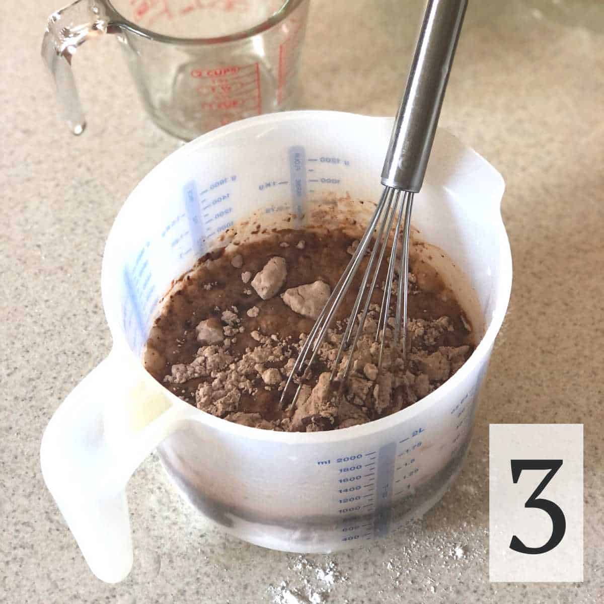 Water and oil being mixed into dry cupcake ingredients.
