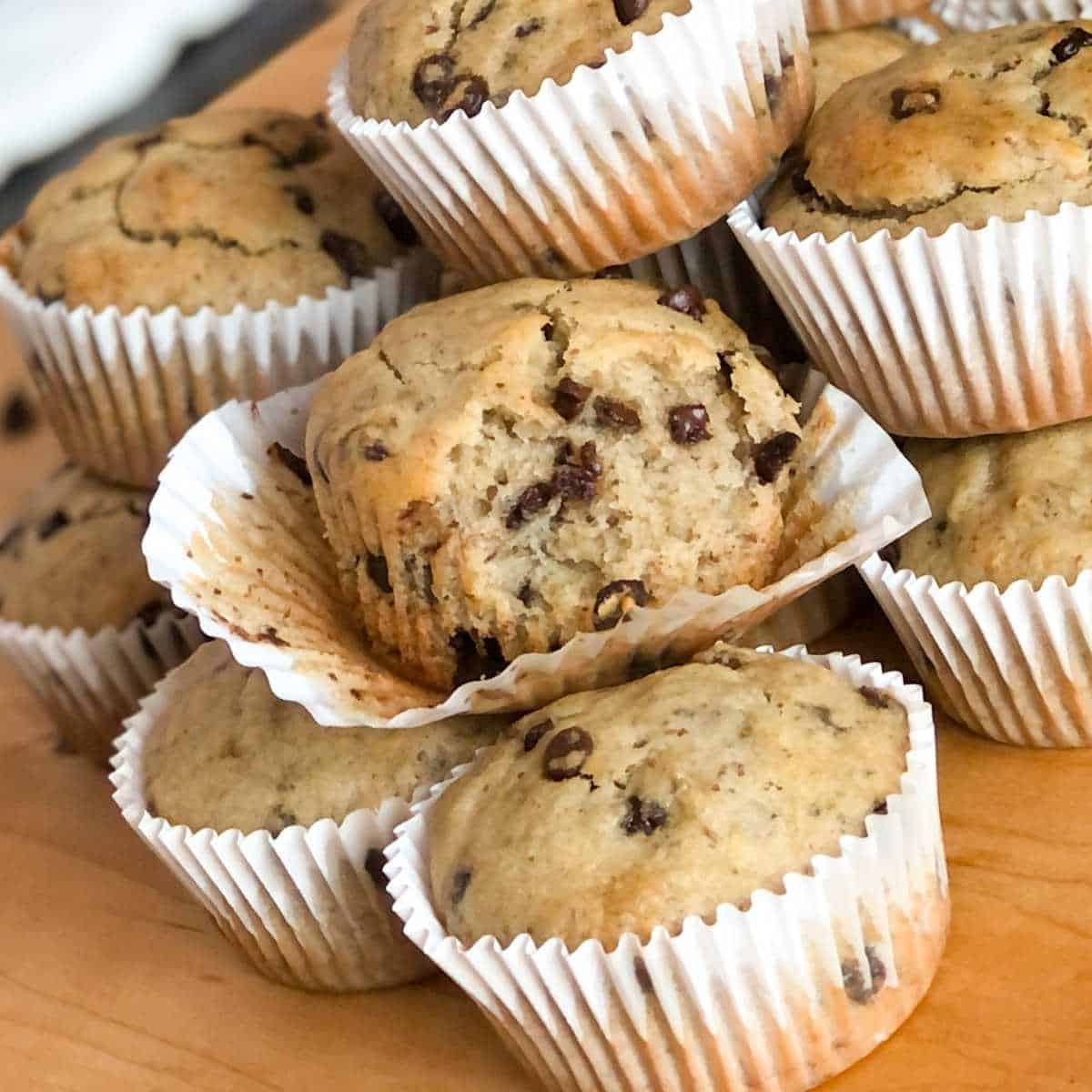 A gluten free chocolate chip banana muffin with a bite out of it.