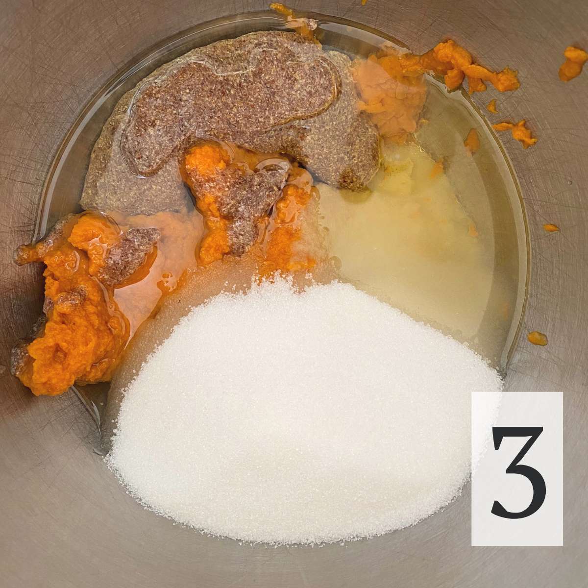 Sugar, pumpkin puree, applesauce, oil, ground flaxseed and water in a mixing bowl.