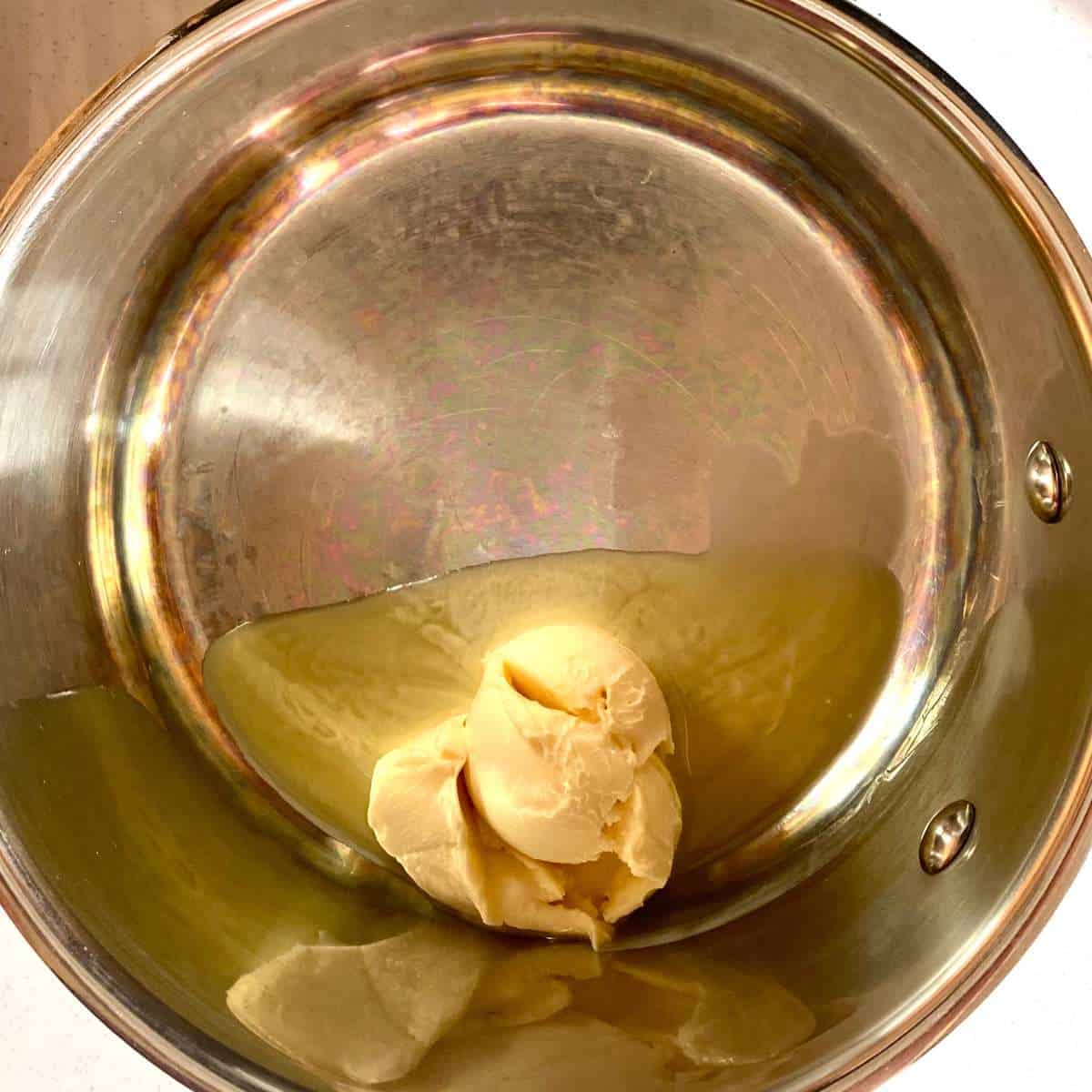 Dairy free margarine melting in a saucepan