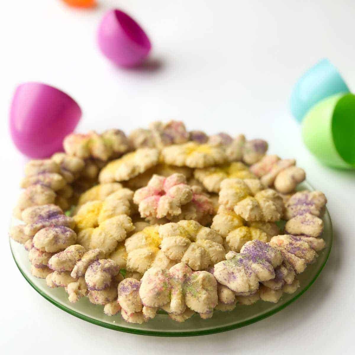 A plate of spring themed gluten free vegan spritz cookies.
