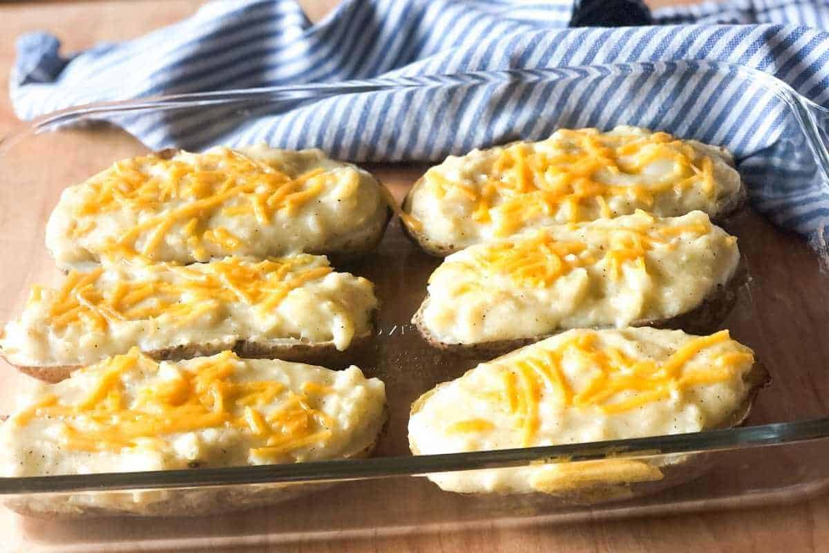 Vegan twice baked potatoes in a baking dish.